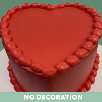 Heart-shaped cake with red frosting on a white background