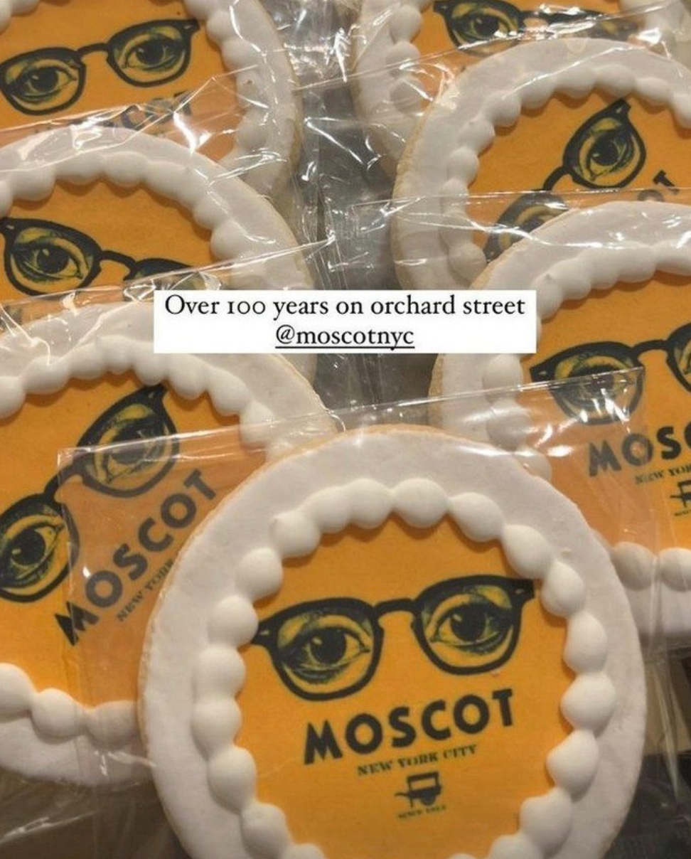 Moscot eyewear coasters with branding on a yellow background